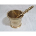 Brass pestle and mortar.