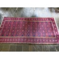 A Persian hand knotted Beluchi rug