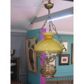 Vintage hanging lamp with orange shade.