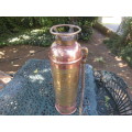An antique copper and brass `Alert` fire extinguisher.