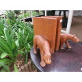 Pair of large wooden bookends with leopards