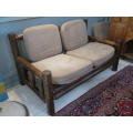 2 seater log bench with cushions.