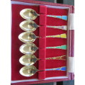 Boxed set of 6 hallmarked silver gilt and enamel teaspoons.