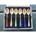 Boxed set of 6 hallmarked silver gilt and enamel teaspoons.