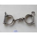 A pair of antique 1880`s Hiatt best warranted wrought handcuffs with key