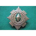 South Africa - 1899-1939 - Kimberley Regiment Voided Cap or Pouch Badge ?
