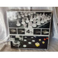 Set of 4 Glass Games -a few pieces have chips- still in box