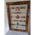 A Framed Collection of 53 World Cassino Chips Frame47cm x 68cm x3cm.