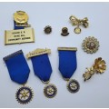 9 x Rotary International Items President and Past President Medals , Pins and Brooches