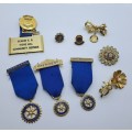 9 x Rotary International Items President and Past President Medals , Pins and Brooches
