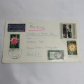 Airmail cover from Schmolln, DDR to Paarl, South Africa with airmail tag and Par Avion ink cancel