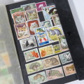 Lot of 380 animal stamps in album - Dogs, cats and other animals