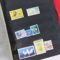Lot of over 230 British and other stamps in album