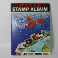 Old stamp album with over 300 stamps - some loose