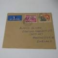 Postal cover posted from Takoradi, Ghana to Manchester, England with 2 gold Gold Coast stamps - genu