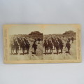 Boer War stereoscope card #25 - Her Majesty`s Heroes marching into Colesberg after the Boers retreat