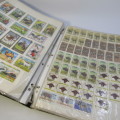 Thematic stamp collection with about 400 stamps - glued to paper