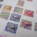 Stamp album with over 730 stamps Including Japan, Saudi Arabia, India, India and more