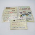 Lot of 9 folders with more than 200 SWA mint stamps