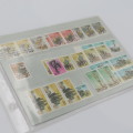 Lot of 9 folders with more than 200 SWA mint stamps