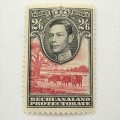Bechuanaland protectorate SACC 121 mint stamp with 2/6 with color shift of red printing to the left