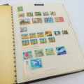 Album with over 1850 stamps - Many mint condition