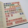 16 Page stamp album with over 700 old stamps - Some better stuff - Have a look at the photos