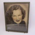 Vintage photo frame with antique coloured picture