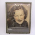 Vintage photo frame with antique coloured picture