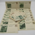 Lot of 30 unused vintage postcards with South African scenes and pre printed 12 d stamps