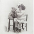 Postcard - vintage Girl with teddy bear