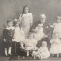Antique photo of a Grandfather with 11 grandchildren