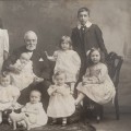 Antique photo of a Grandfather with 11 grandchildren