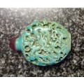 Turquoise coloured snuff bottle with red lid