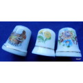 PORCELAIN THIMBLES - 3 - NO MAKERS MARKS (2 WITH FLOWERS - 1 POMPEI)
