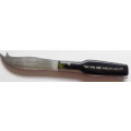 STAINLESS STEEL CHEESE KNIFE - BOTTLE SHAPED HANDLE - `SALT RIVER SWEET WORKS (PTY) LTD`