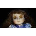 Collectors Doll with Glasses. Purple outfit. -Not Marked