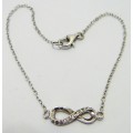 A Fine Sterling Silver Bracelet Chain with Figure 8 Set with CZ's