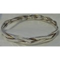 A Very Attractive Silver Bangle of Three Intertwined Bands.