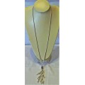 Interesting Long Pendant of Simulated Pearls and Baubles on Silver Coloured Chain