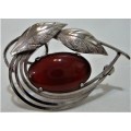 A Really Nice Silver Coloured  Brooch set with an Amber Coloured Stone