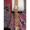 A Ladies Precimax Stylish Cocktail watch with gold clad strap