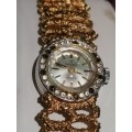 A Ladies Precimax Stylish Cocktail watch with gold clad strap