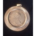 A Silver pendant with SA silver coin