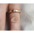 A  beautiful 18k gold ring set with single fine diamond