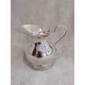 A finly crafted Spanish silver creamer or jug