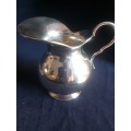 A finly crafted Spanish silver creamer or jug
