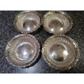 A set of 4 sterling table serving bowls