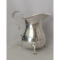 A Small clean lined Sterling Cram Jug / oil pour