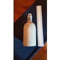Collectable Stone Bottle (empty) with flip-top stopper and brace.  No label. Colour: Grey/white.